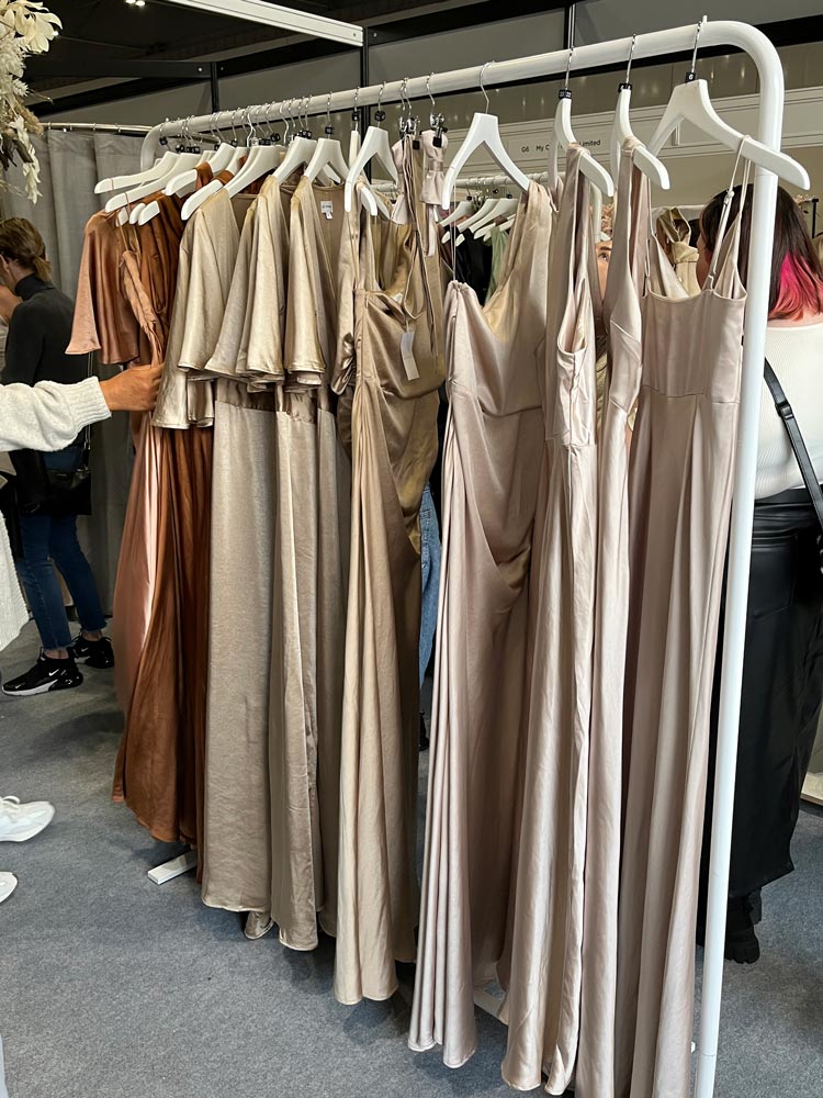 Elegant dresses on display at a fashion boutique.