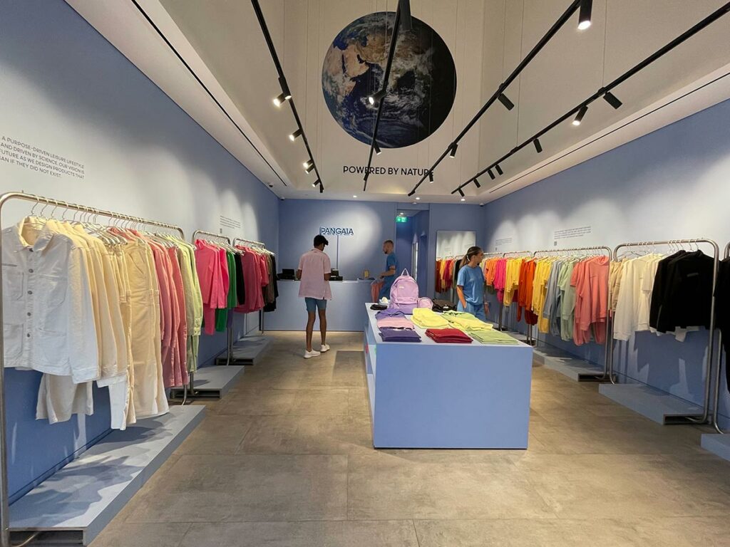 Colorful clothing display in modern retail store with event hire furniture