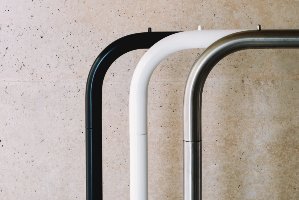 London furniture rental display with modern white chairs and tables in a showroom.