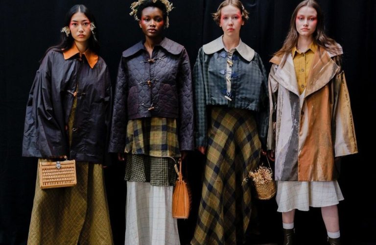 A group of people at a fashion event with rental furniture from FoundPop.